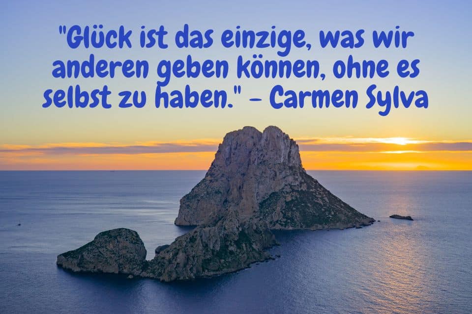 Steininsel mit Zitat: "Glück ist das einzige, was wir anderen geben können, ohne es selbst zu haben." - Carmen Sylva